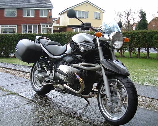 bike-001.jpg - New Bike. Front quarter view. Notice the hail on the ground. This is just how you want to collect your new bike. Slippery new tyres on a new bike, hailing and slippery roads.