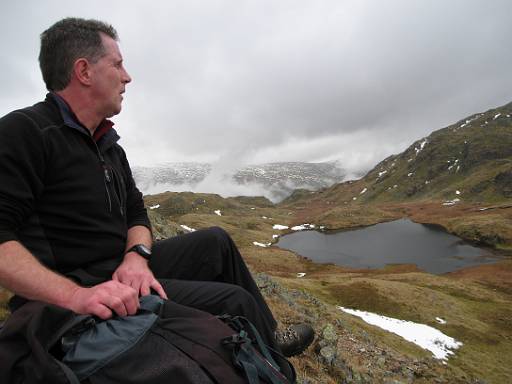 13_34-1.jpg - Dave overlooking Tarn-at-Leaves