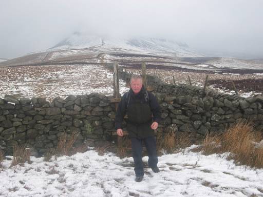 13_29-3.jpg - Pen-y-ghent almost hidden in cloud as Mick crosses the stile.