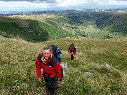 12_33-2.jpg - Steve and Cath climbing Selside. With views into Swindale.