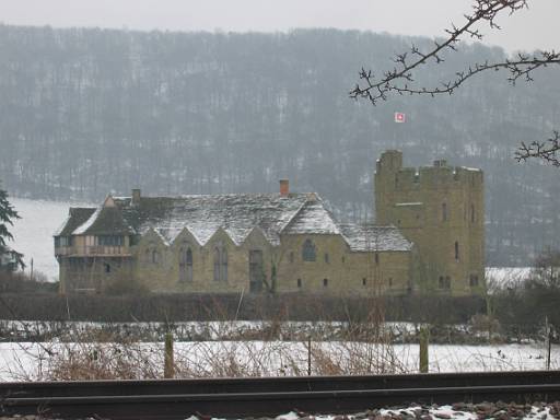 12_03-1.jpg - Stokesay Castle across the railway line. Day has been fairly pleasant this far with slippery Stokesay Hill a highlight. From here the going is level but heavily ploughed - look for a road if you do this again, time is better spent in Ludlow than wallowing in mud in the fields.