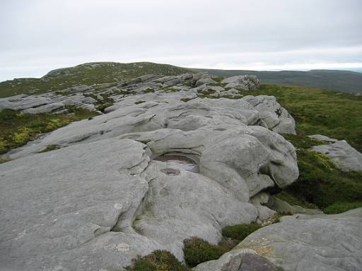 12_41-1.jpg - Rocks on the ridge, with deep sink holes between.