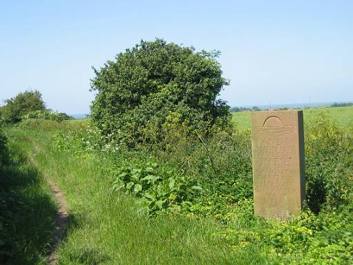 14_17-1.JPG - Sculpture on the trail. With the sea visible behind. Almost at Holme! And I being herehave been part of all this. Caught & thrown like sun on water have entered into all around