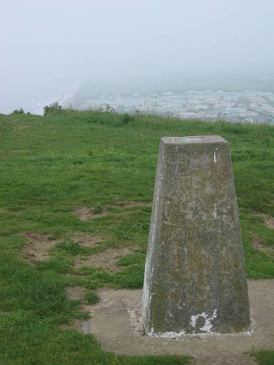 09_39-1.JPG - Sheringham lump with a caravan park behing. Strangely the Coast Path turns inland here until you reach the finish at Cromer.